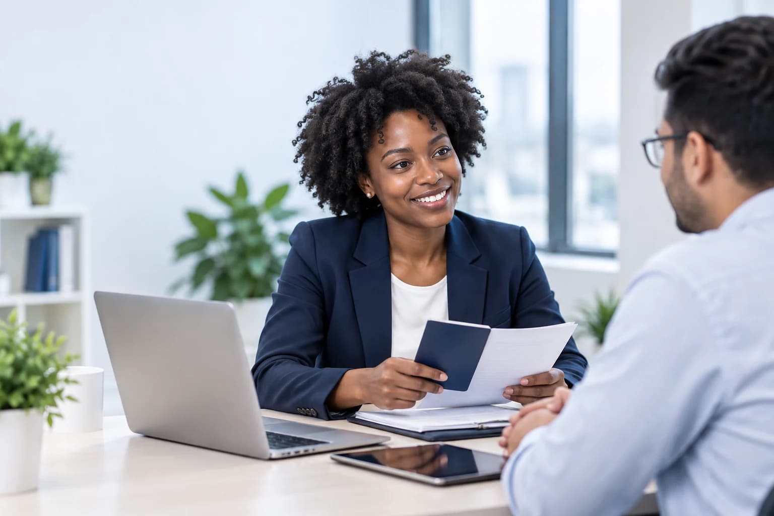 An immigration professional reviewing a case with a client